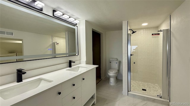 full bath with a shower stall, toilet, marble finish flooring, and double vanity