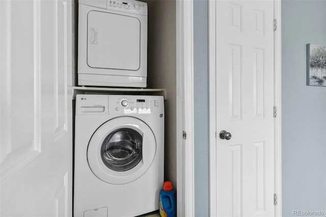 laundry room with stacked washer / dryer