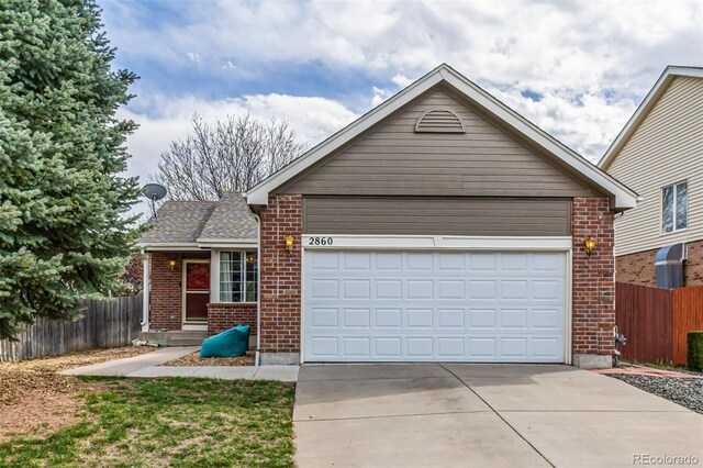 ranch-style house with brick siding, an attached garage, concrete driveway, and fence