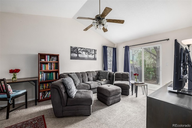 carpeted living room featuring vaulted ceiling and ceiling fan