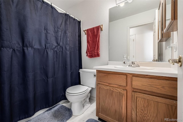 full bathroom featuring vanity, tile patterned flooring, a shower with shower curtain, and toilet