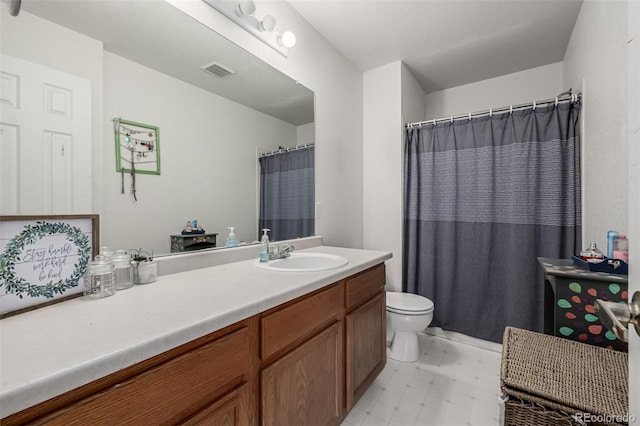 full bath with visible vents, vanity, and toilet