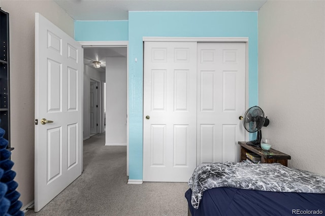 carpeted bedroom with a closet