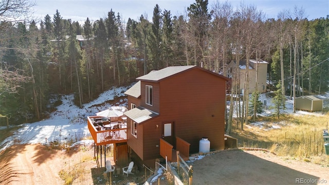 view of home's exterior with a wooden deck