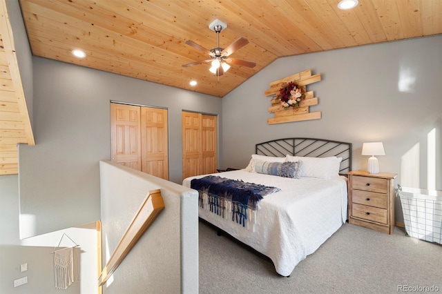 carpeted bedroom with multiple closets, lofted ceiling, wooden ceiling, and ceiling fan