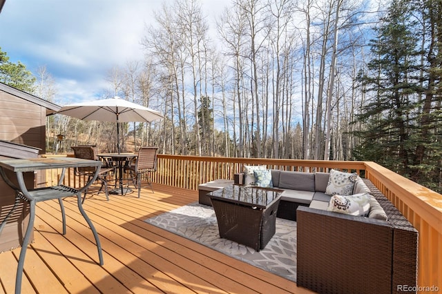 deck featuring outdoor lounge area