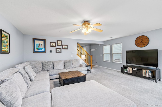 living room with ceiling fan and carpet flooring