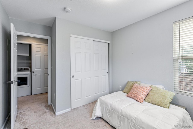 bedroom featuring light carpet and a closet