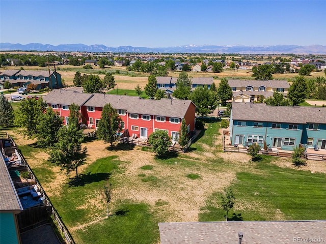 birds eye view of property with a mountain view