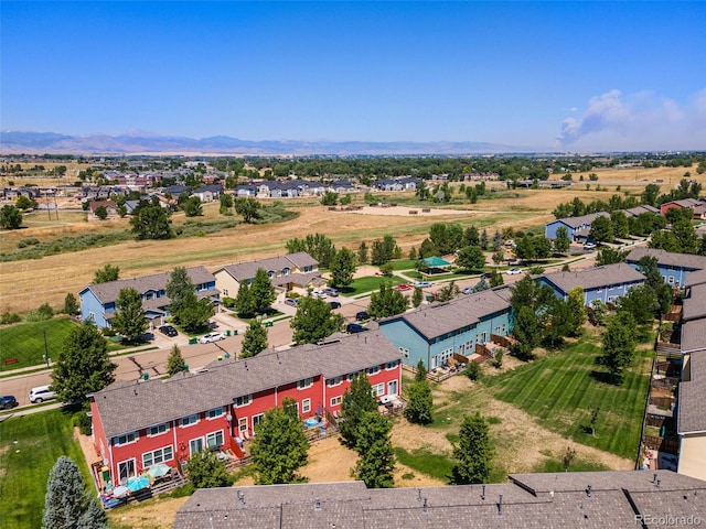 birds eye view of property with a mountain view