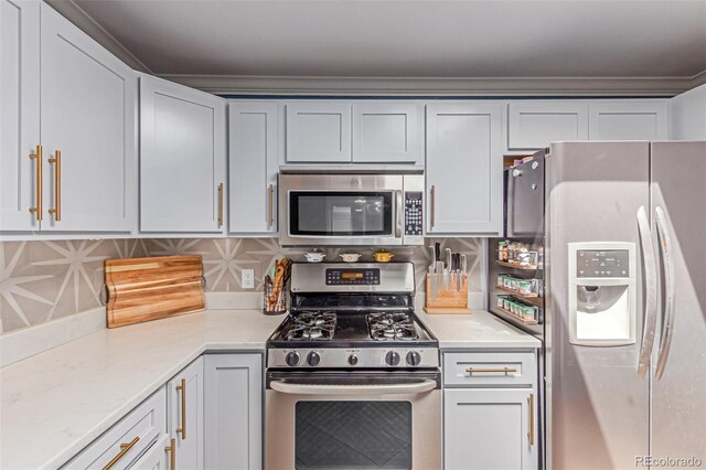 kitchen featuring appliances with stainless steel finishes and backsplash