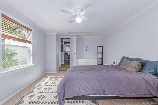 bedroom with baseboards, light carpet, crown molding, attic access, and a ceiling fan