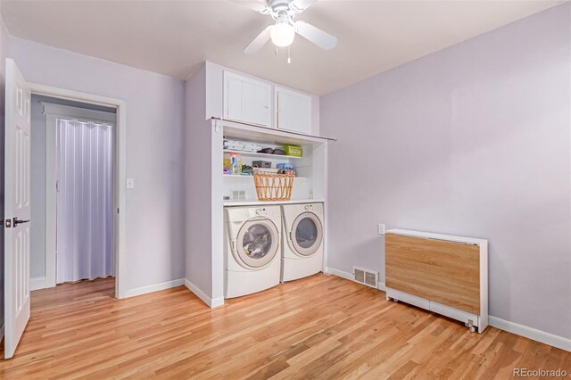 washroom with washer and dryer, a ceiling fan, light wood-style floors, and baseboards
