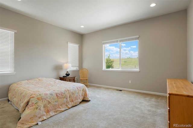 bedroom featuring recessed lighting, visible vents, baseboards, and light carpet