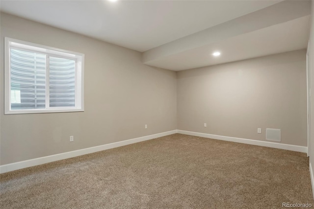 carpeted empty room with recessed lighting and baseboards