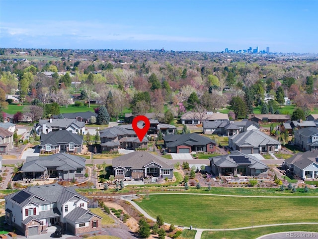 birds eye view of property with a residential view