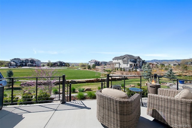view of patio featuring a residential view and a balcony