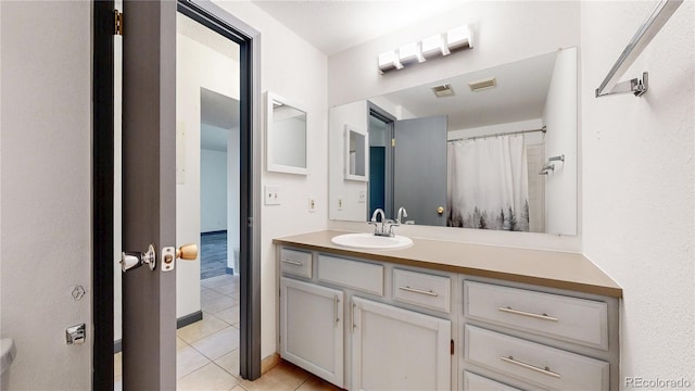 3526 S Depew St Unit 102, Lakewood, CO 80235 - bathroom featuring tile patterned flooring and vanity