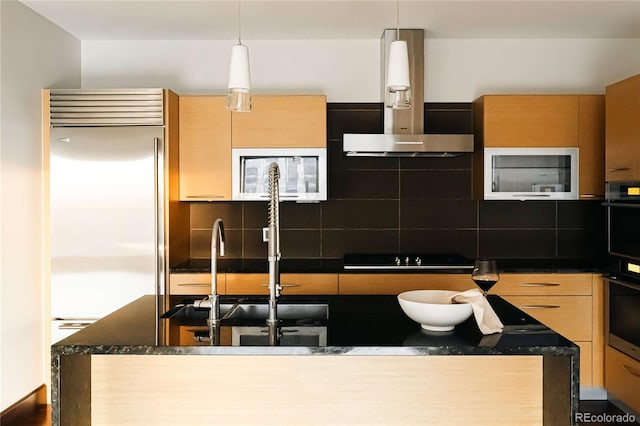 1133 14th St Unit 2110, Denver, CO 80202 - kitchen featuring ventilation hood, appliances with stainless steel finishes, backsplash, and decorative light fixtures