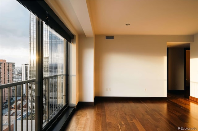 1133 14th St Unit 2110, Denver, CO 80202 - empty room with hardwood / wood-style flooring and a city view