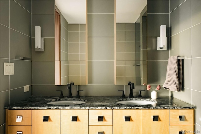1133 14th St Unit 2110, Denver, CO 80202 - bathroom featuring double vanity and tile walls