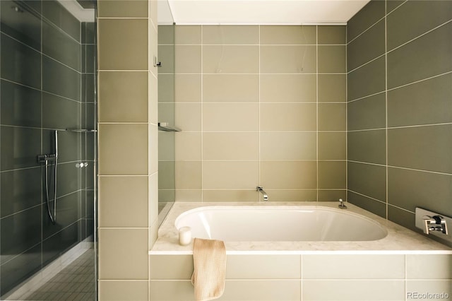 1133 14th St Unit 2110, Denver, CO 80202 - full bathroom featuring tile walls and a garden tub