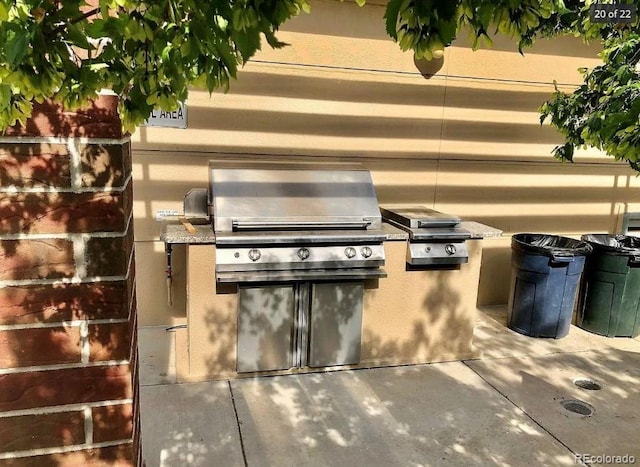 view of patio featuring area for grilling and an outdoor kitchen