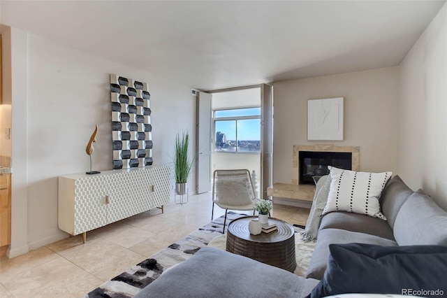 tiled living room featuring a water view