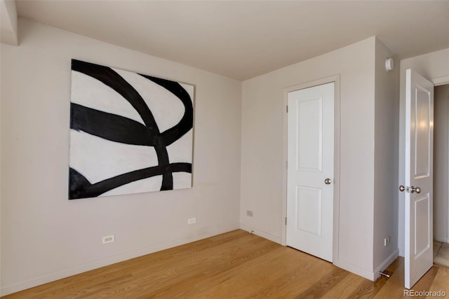 unfurnished bedroom featuring light wood-type flooring