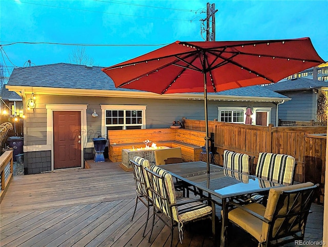 wooden terrace featuring outdoor dining space