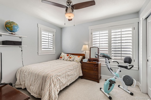 bedroom with baseboards, a ceiling fan, and carpet floors