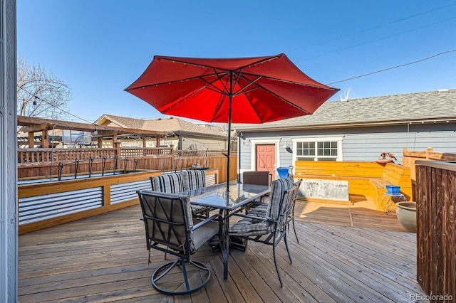 wooden deck with outdoor dining space