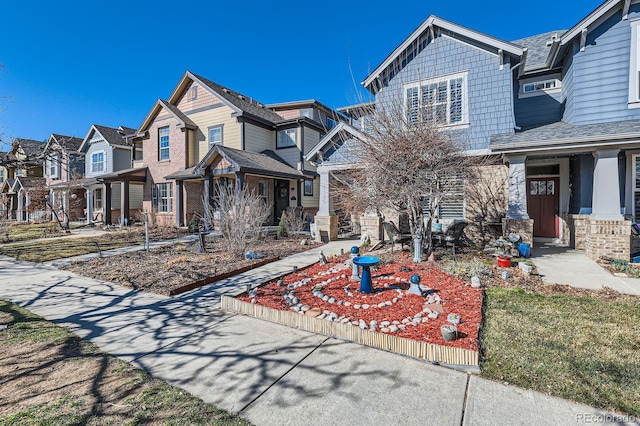 view of front of house featuring a residential view and stone siding