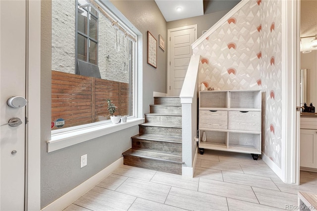 stairs featuring baseboards