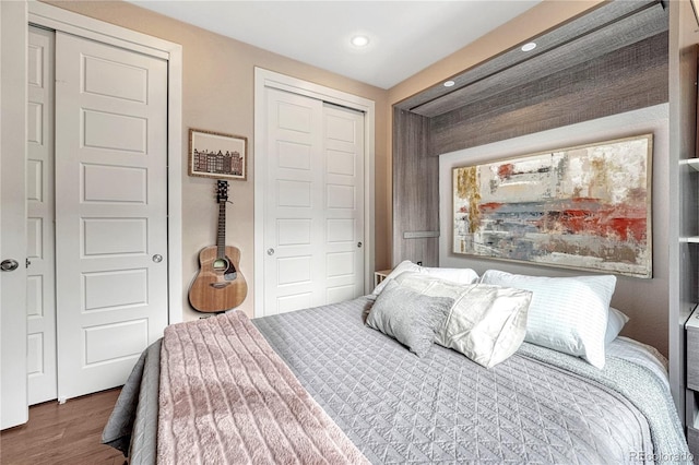 bedroom featuring a closet, recessed lighting, and wood finished floors