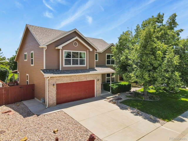 13235 Clermont Cir, Thornton, CO 80241 - view of front of home featuring a garage, driveway, a shingled roof, and brick siding