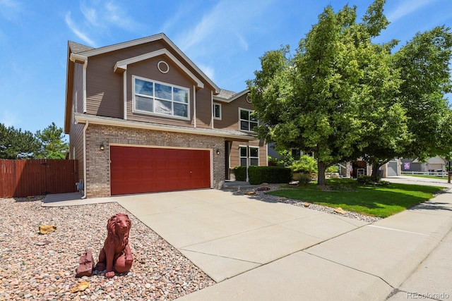 13235 Clermont Cir, Thornton, CO 80241 - view of front of house with an attached garage, brick siding, and driveway
