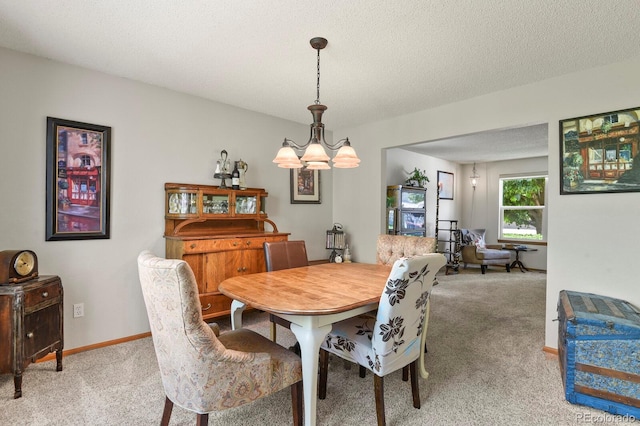 13235 Clermont Cir, Thornton, CO 80241 - dining space with carpet flooring, a chandelier, and a textured ceiling