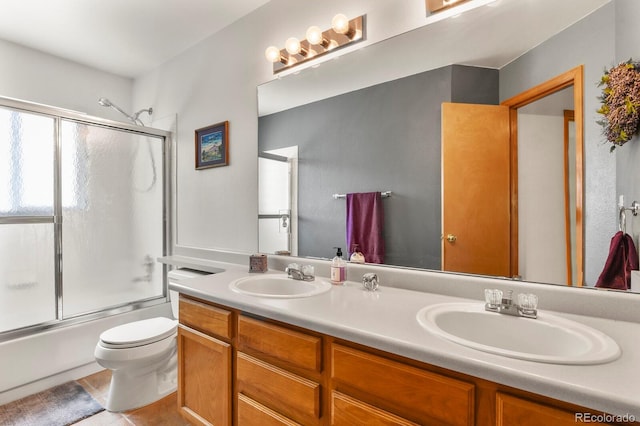 13235 Clermont Cir, Thornton, CO 80241 - full bathroom featuring double vanity, bath / shower combo with glass door, and tile patterned flooring