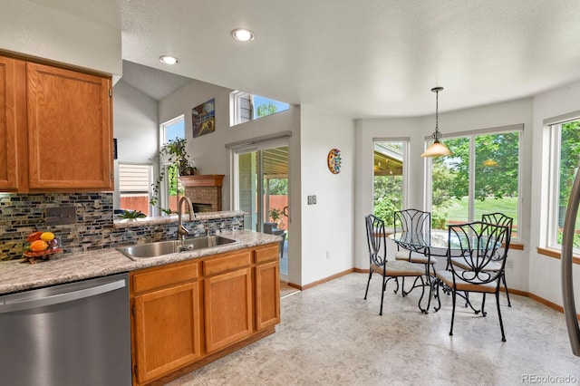 13235 Clermont Cir, Thornton, CO 80241 - kitchen with dishwasher, tasteful backsplash, and brown cabinetry