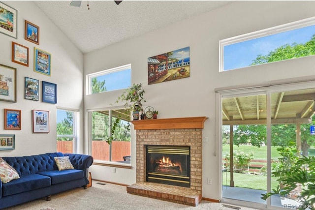 13235 Clermont Cir, Thornton, CO 80241 - carpeted living area with ceiling fan, a fireplace, high vaulted ceiling, and a textured ceiling