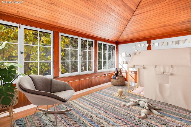 sunroom / solarium with lofted ceiling and wood ceiling