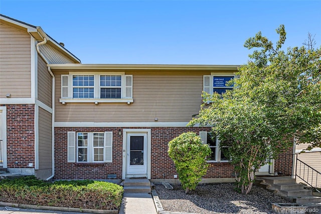 1545 S Ouray Cir Unit B, Aurora, CO 80017 - view of property with brick siding