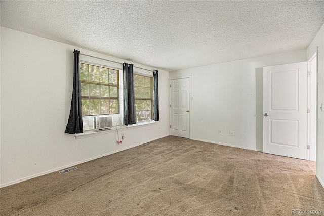 1545 S Ouray Cir Unit B, Aurora, CO 80017 - unfurnished room with carpet and a textured ceiling