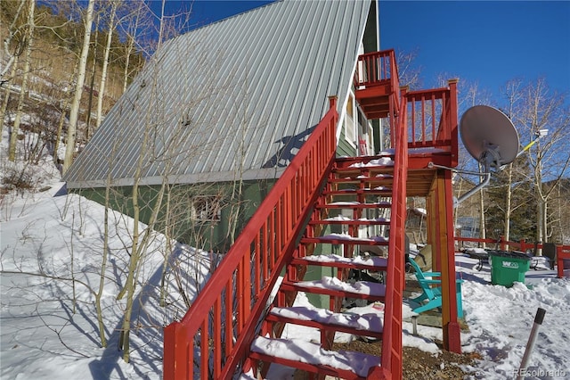 snow covered playground with stairs