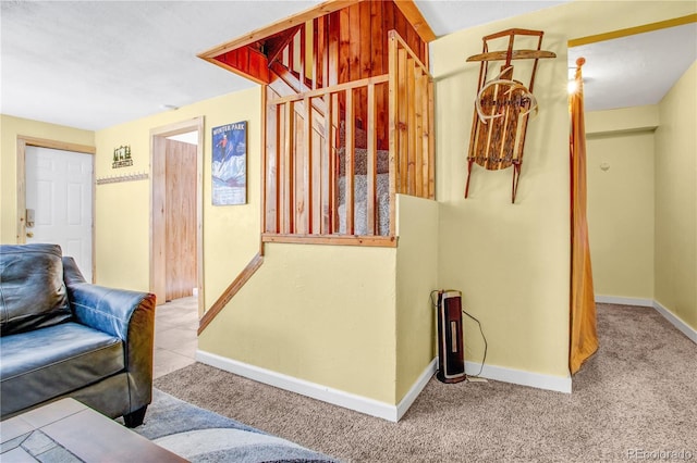 interior space featuring carpet floors and baseboards