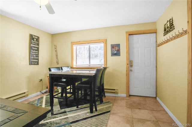 dining area with light tile patterned floors, ceiling fan, baseboard heating, and baseboards