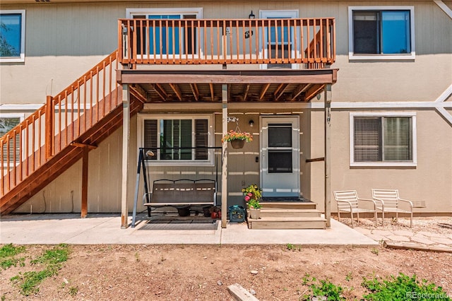 2408 N 7th St Unit A, Colorado Springs, CO 80907 - property entrance featuring a wooden deck and a patio