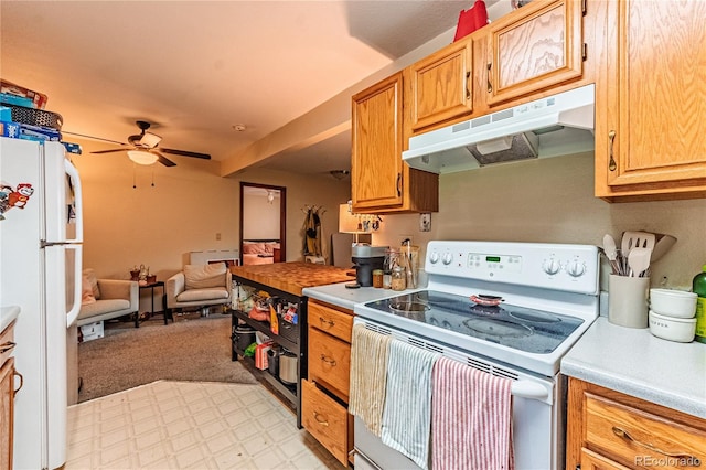 2408 N 7th St Unit A, Colorado Springs, CO 80907 - kitchen with white appliances, under cabinet range hood, light countertops, ceiling fan, and open floor plan