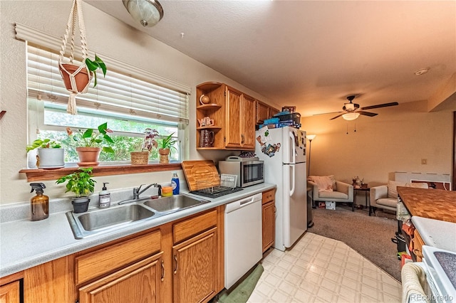 2408 N 7th St Unit A, Colorado Springs, CO 80907 - kitchen with white appliances, a sink, ceiling fan, open shelves, and light floors